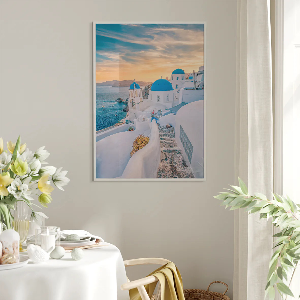 Wall art capturing the beauty of Santorini's sunset with blue domes and whitewashed buildings against a pastel sky