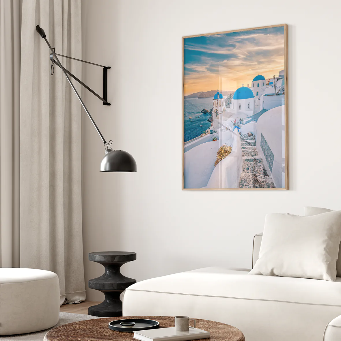 Wall art capturing the beauty of Santorini's sunset with blue domes and whitewashed buildings against a pastel sky