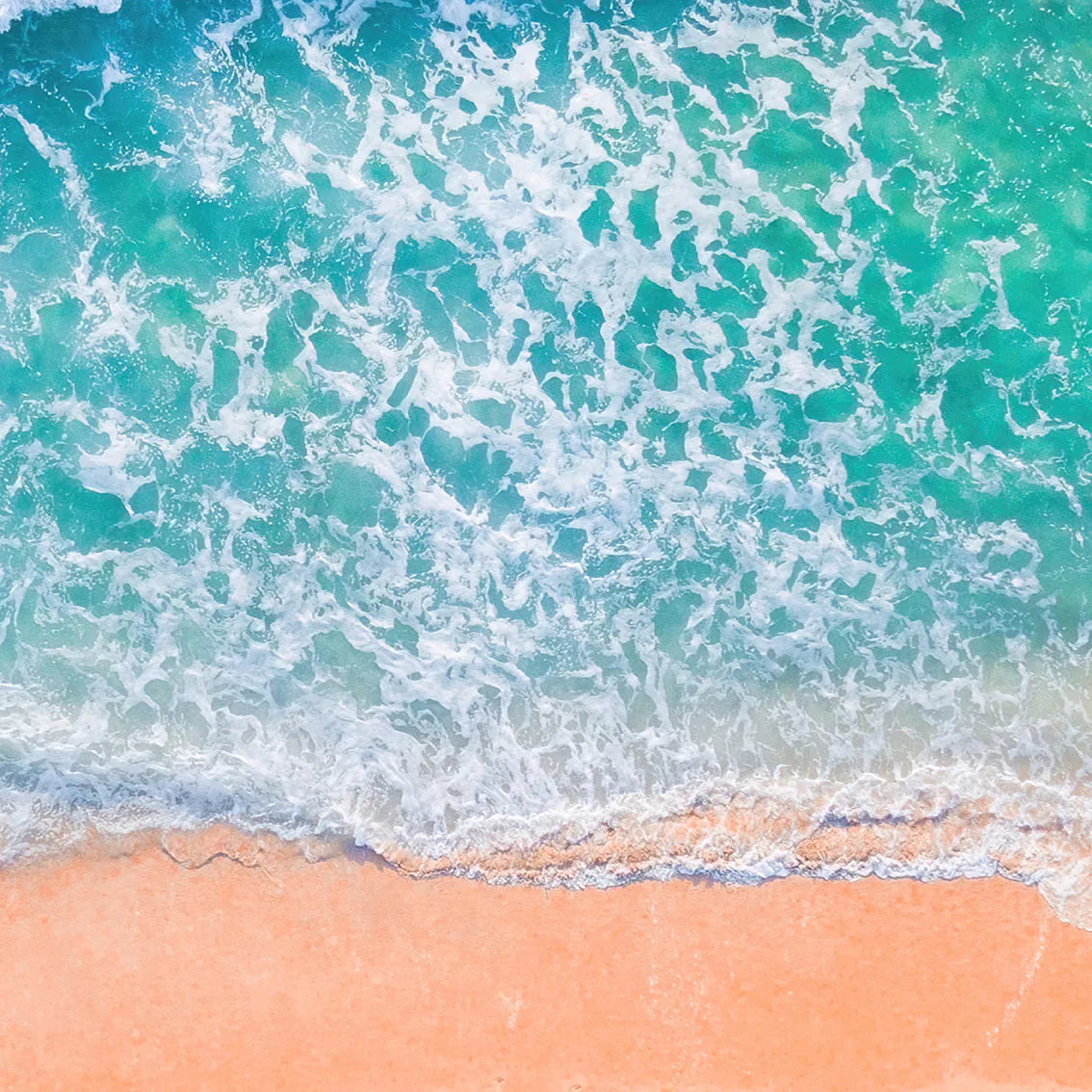 Tranquil beach wall art featuring soft ocean waves on the shore