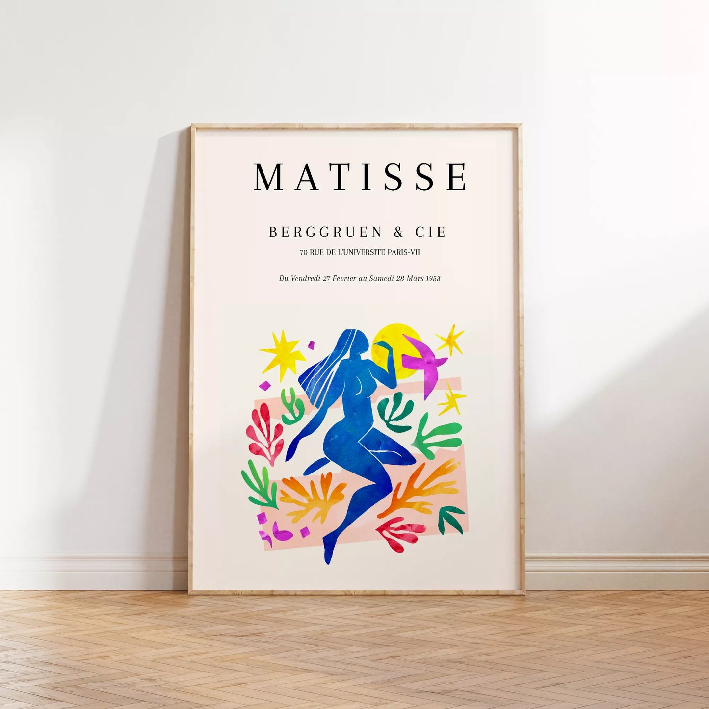 マティス展ポスター、青い人物像と色彩豊かな植物モチーフ