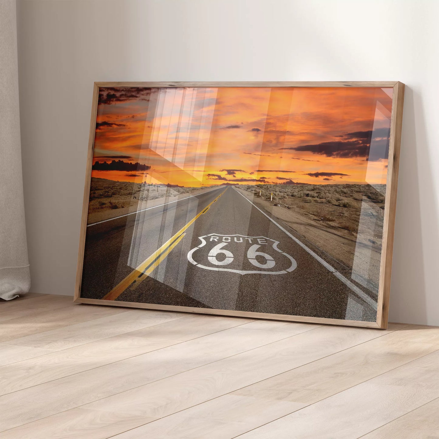 ルート66の象徴的な道路と燃えるような夕焼けの風景アート