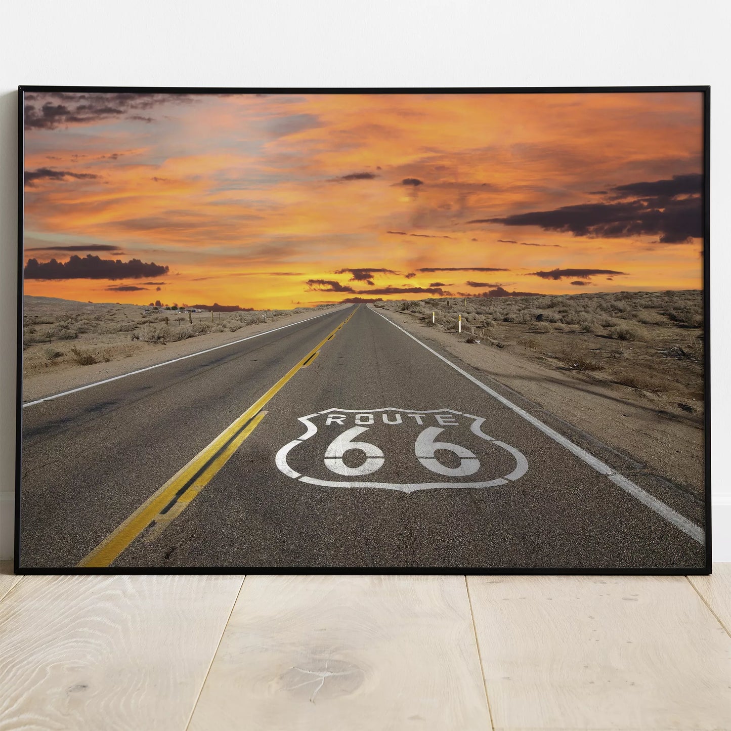 ルート66の象徴的な道路と燃えるような夕焼けの風景アート
