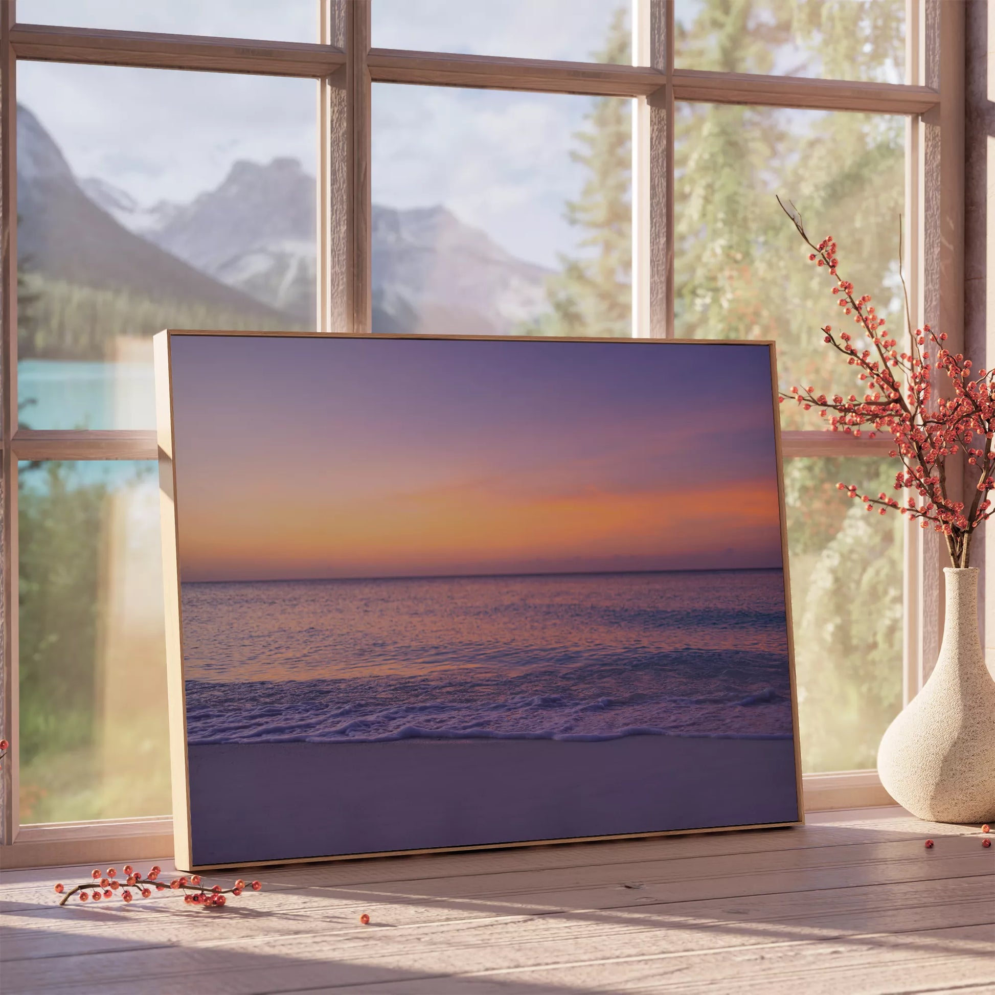 紫とオレンジの夕焼けに染まる穏やかな海の風景