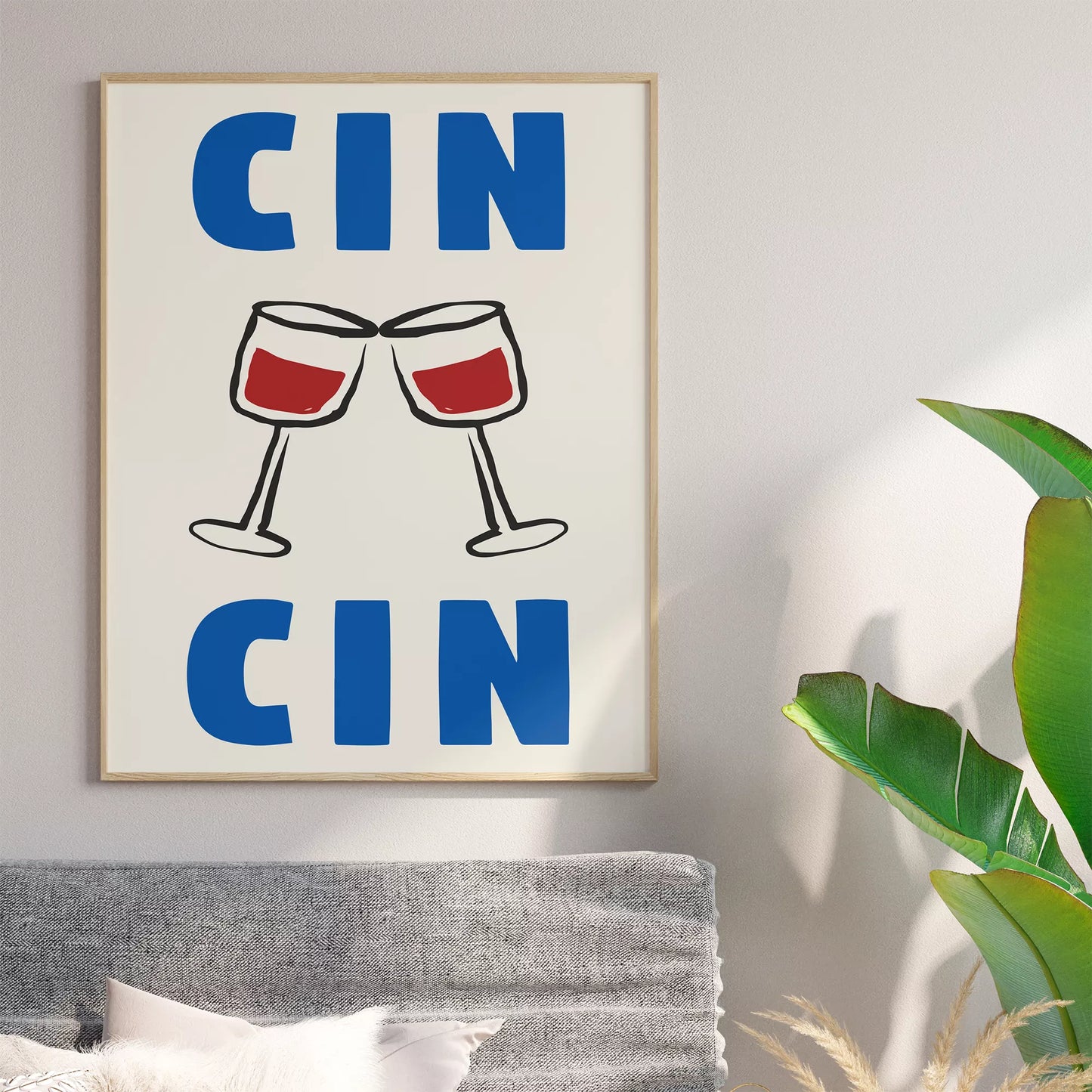 クリーム色の背景にブルーの「CIN CIN」の文字とシンプルな線画で描かれた赤ワインの乾杯グラスを配したミニマリストアートポスター