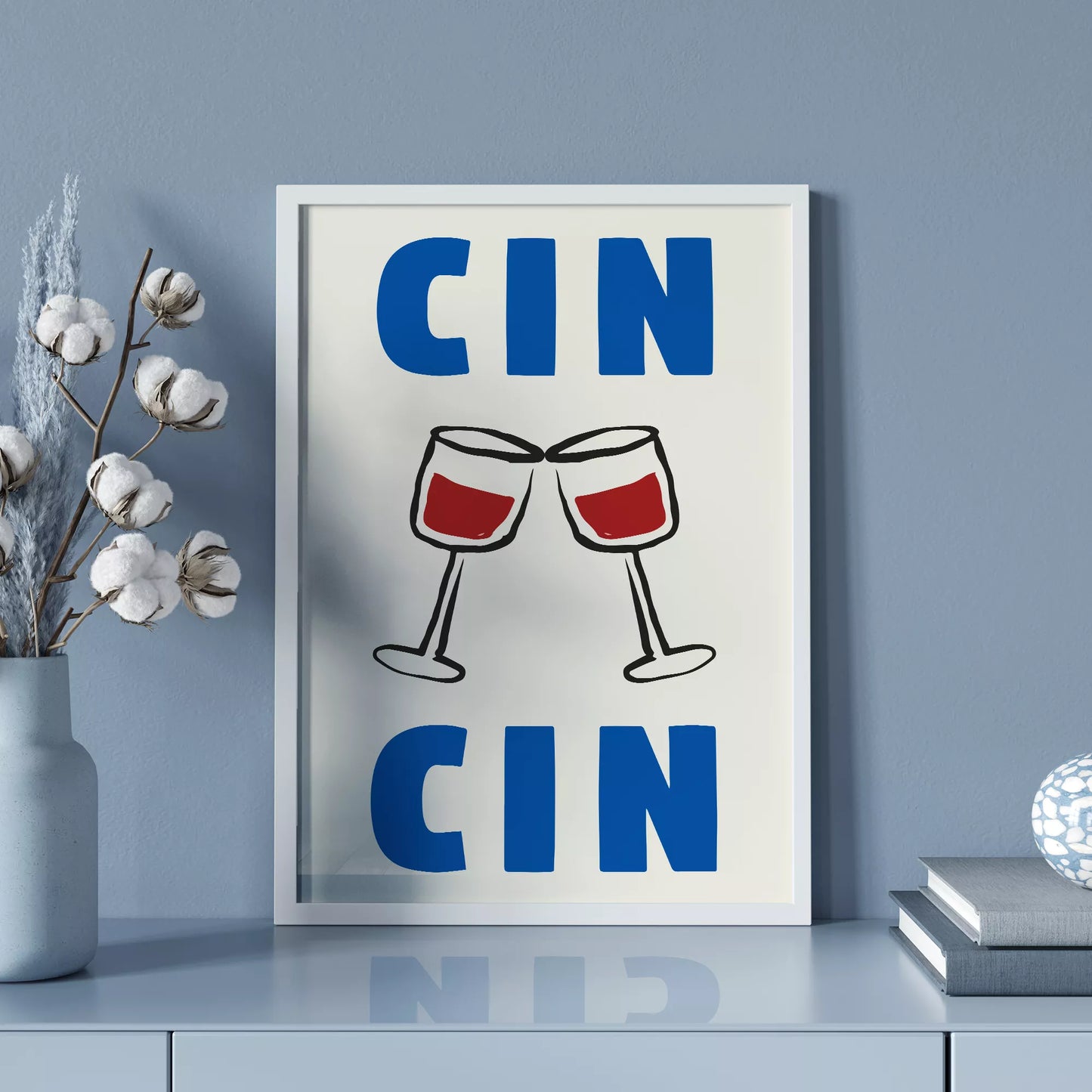 クリーム色の背景にブルーの「CIN CIN」の文字とシンプルな線画で描かれた赤ワインの乾杯グラスを配したミニマリストアートポスター