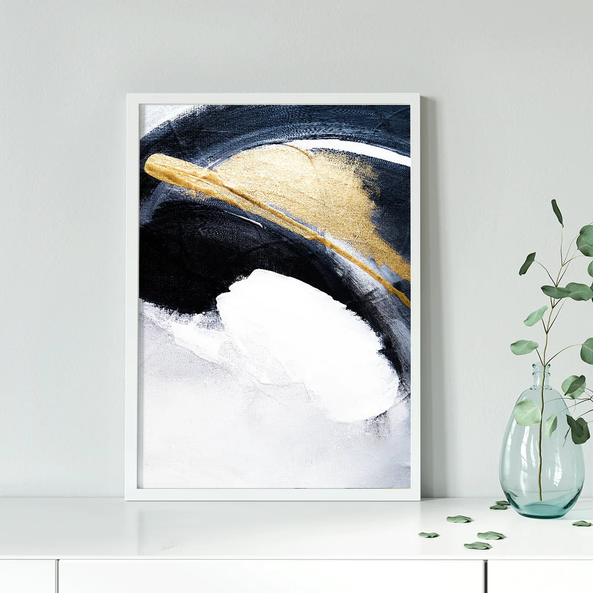 Sophisticated abstract painting with bold white and navy brushstrokes and gold touches