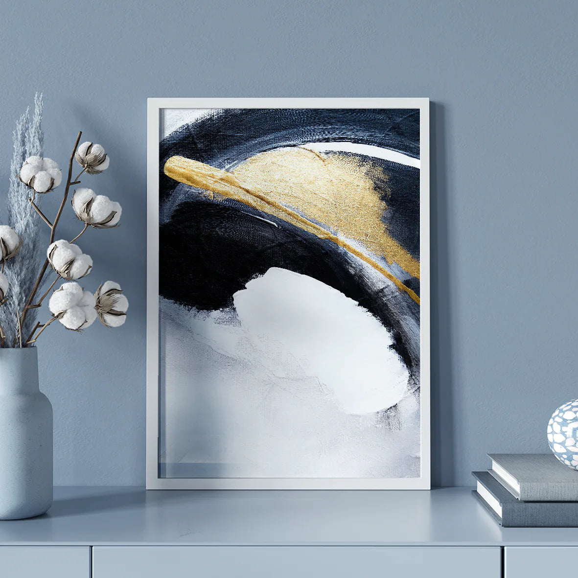 Sophisticated abstract painting with bold white and navy brushstrokes and gold touches