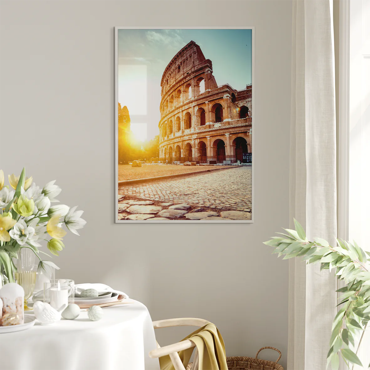 Wall art of the Colosseum in Rome with the sun rising behind it