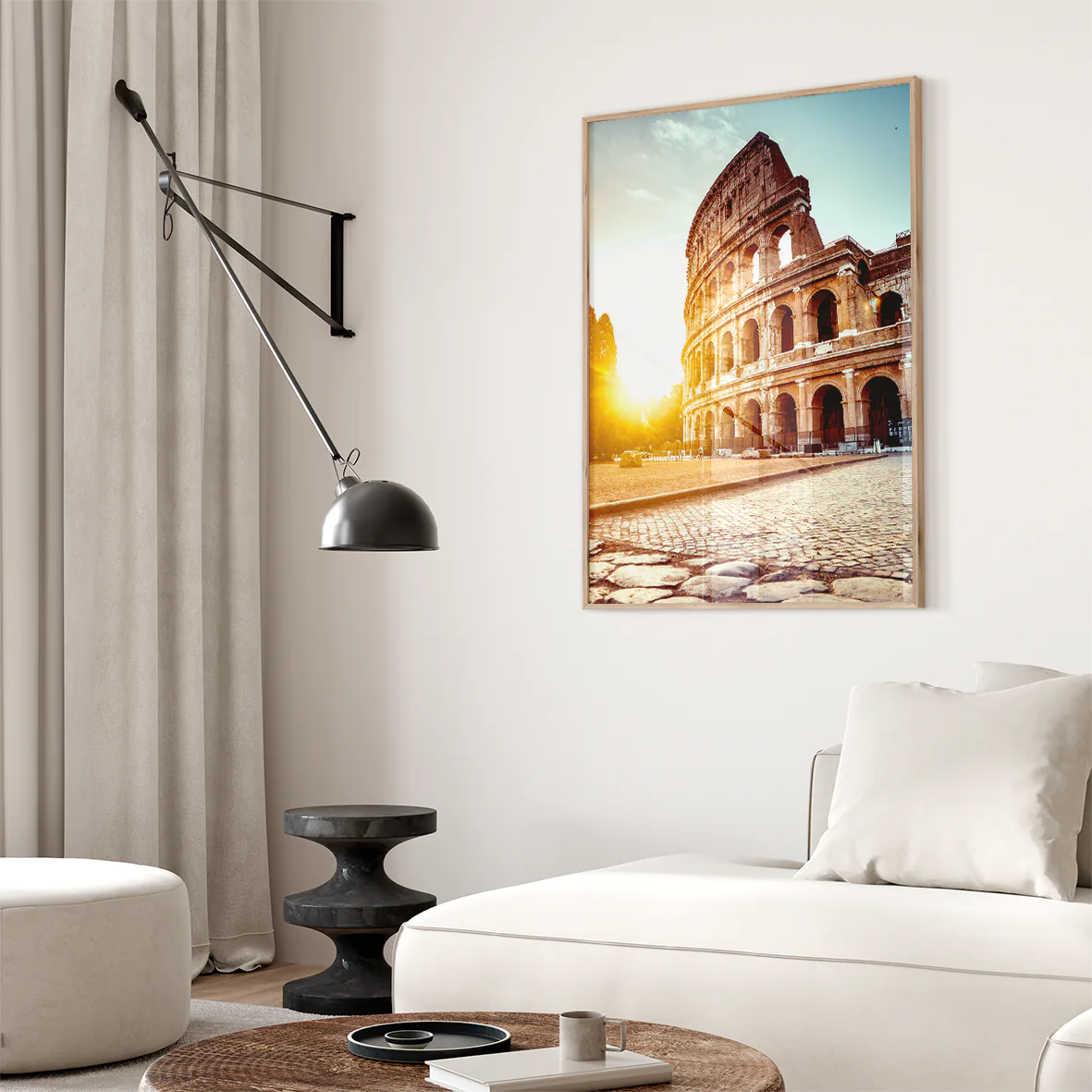 Wall art of the Colosseum in Rome with the sun rising behind it