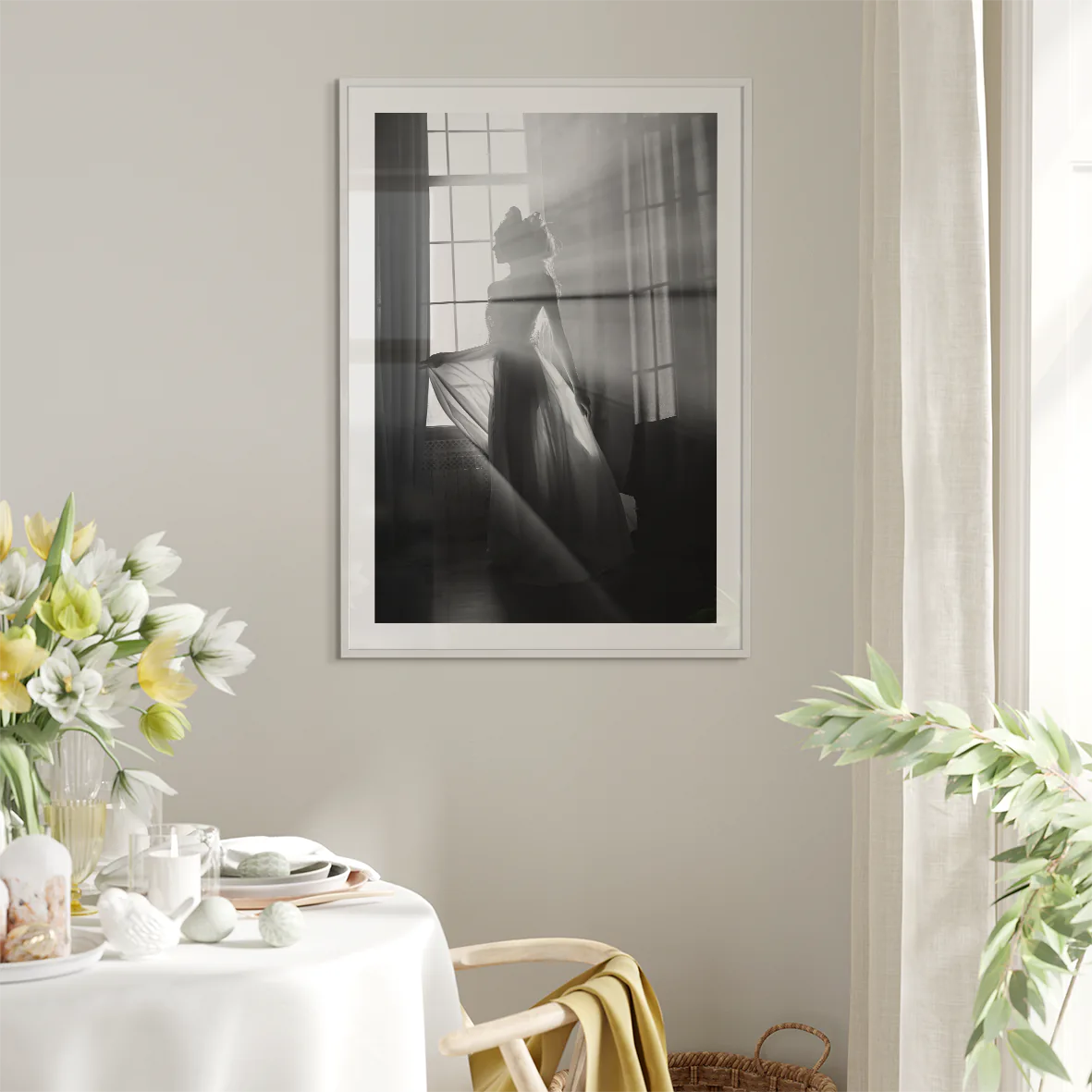 Elegant bride standing by the window, her wedding gown illuminated in the soft light