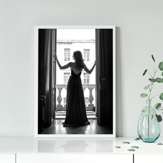 Elegant lady in silhouette against the bright light of an open window