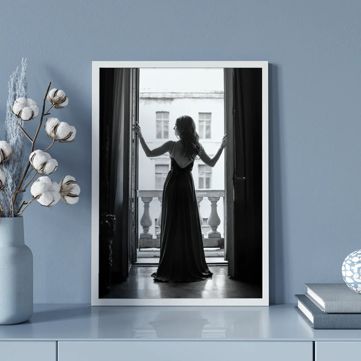 Elegant lady in silhouette against the bright light of an open window