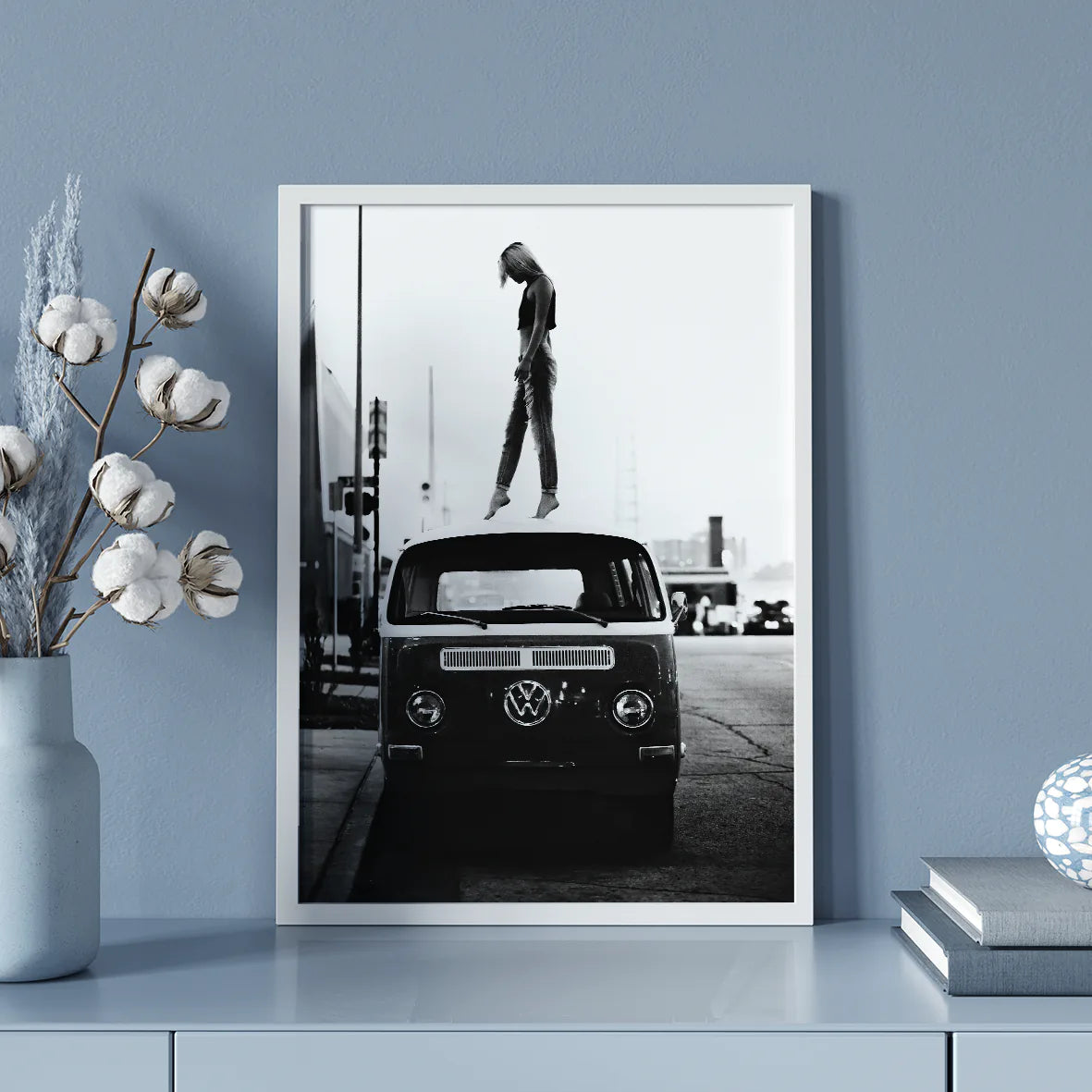 Retro-inspired wall print featuring a person atop a classic VW van