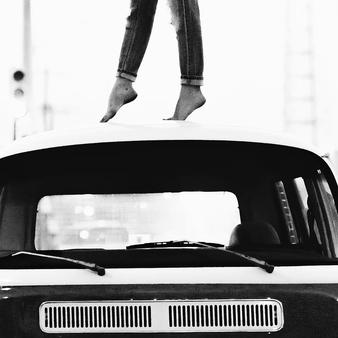 Retro-inspired wall print featuring a person atop a classic VW van