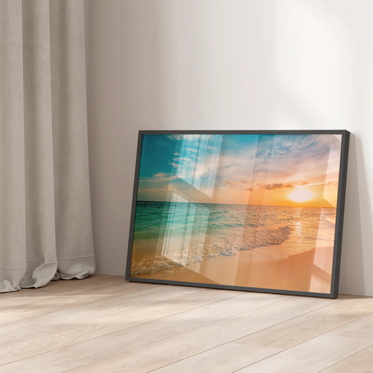 Breathtaking beach sunset wall art with the sun setting over a calm ocean, reflecting warm colors on the water.