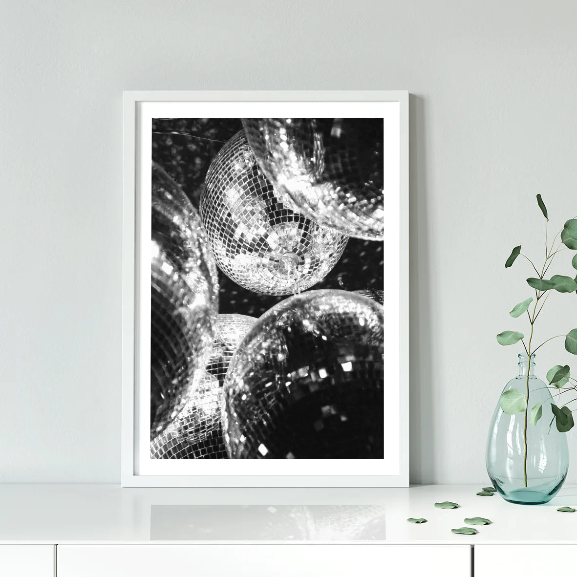 Artistic print of clustered disco balls with light reflections