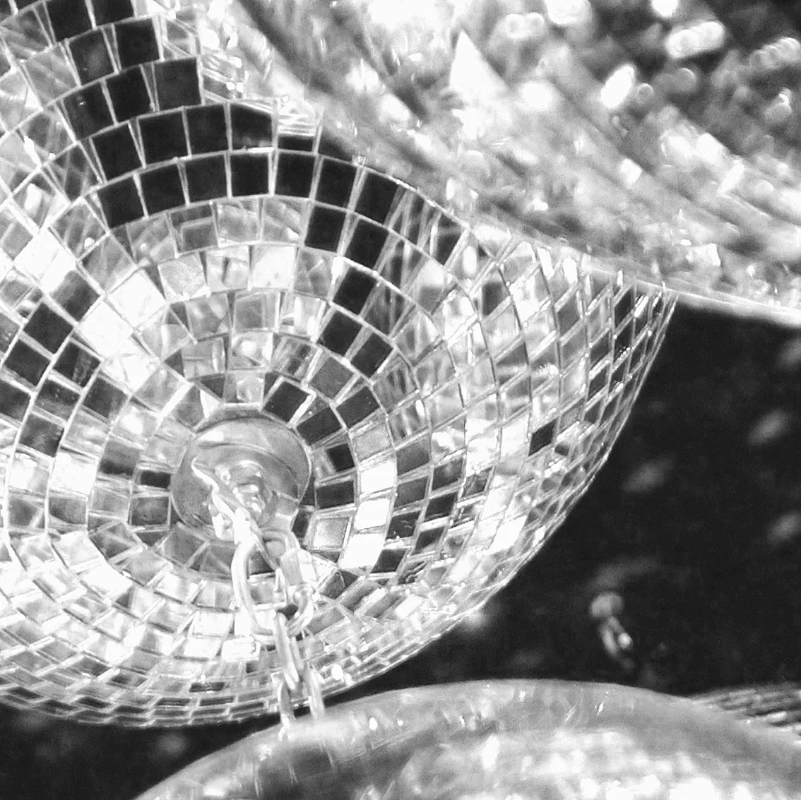 Artistic print of clustered disco balls with light reflections