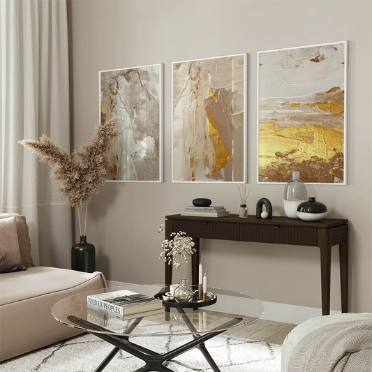 Elegant three-panel wall art set with gold and ivory abstract designs