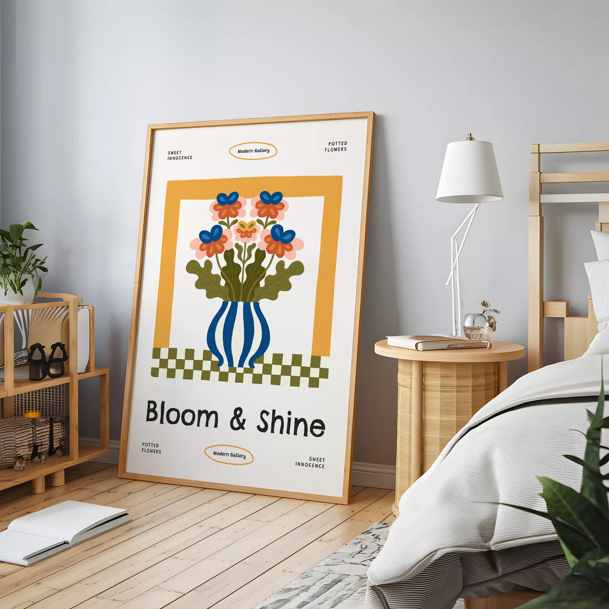 木製家具のある寝室の床に立て掛けた、花と青いストライプ花瓶のポスター