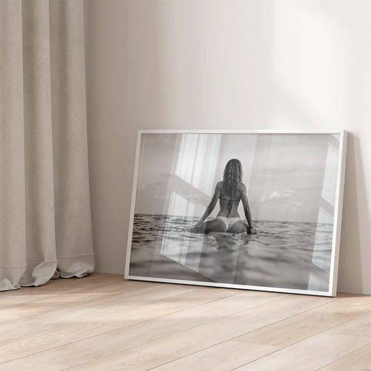 Minimalist beach wall art showcasing a person in thoughtful solitude by the sea