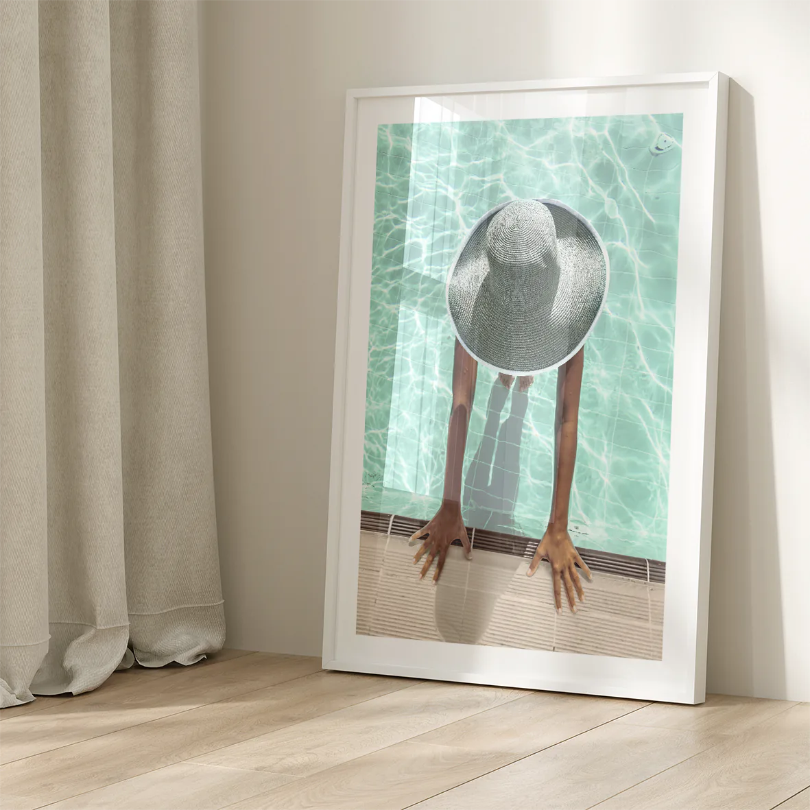 Elegant wall art showcasing a tranquil pool scene with a sunhat-clad figure,