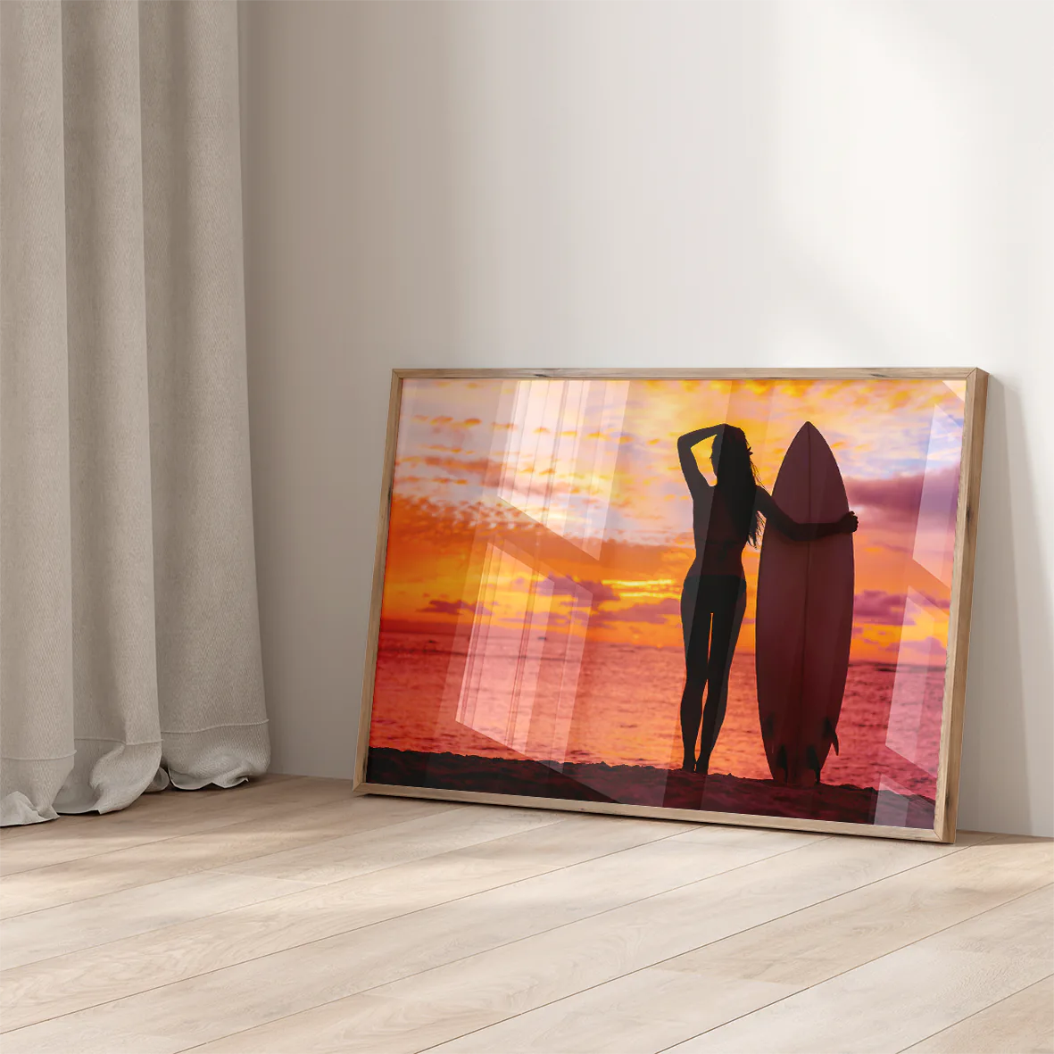 Breathtaking seaside sunset with female surfer holding a surfboard in a wall decor