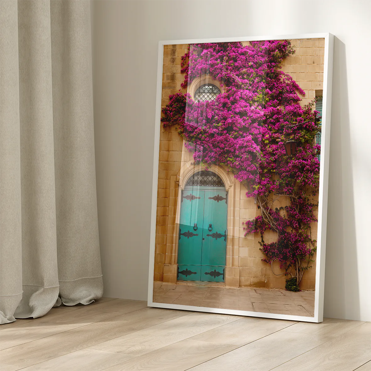 Turquoise door with vibrant purple flowers on a building facade