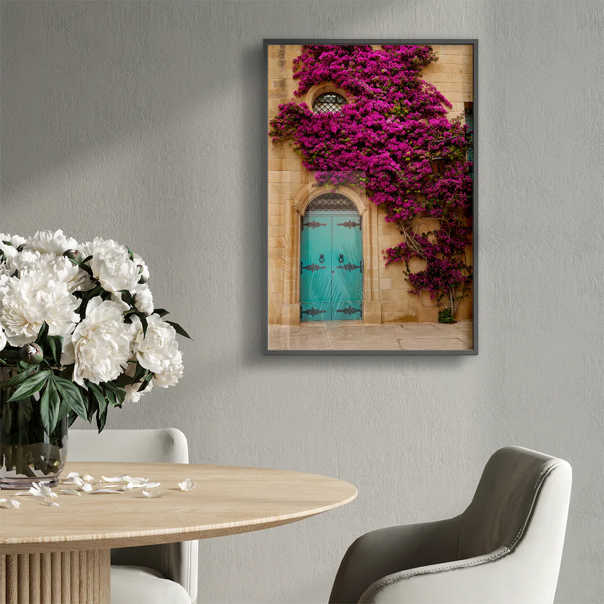 Turquoise door with vibrant purple flowers on a building facade