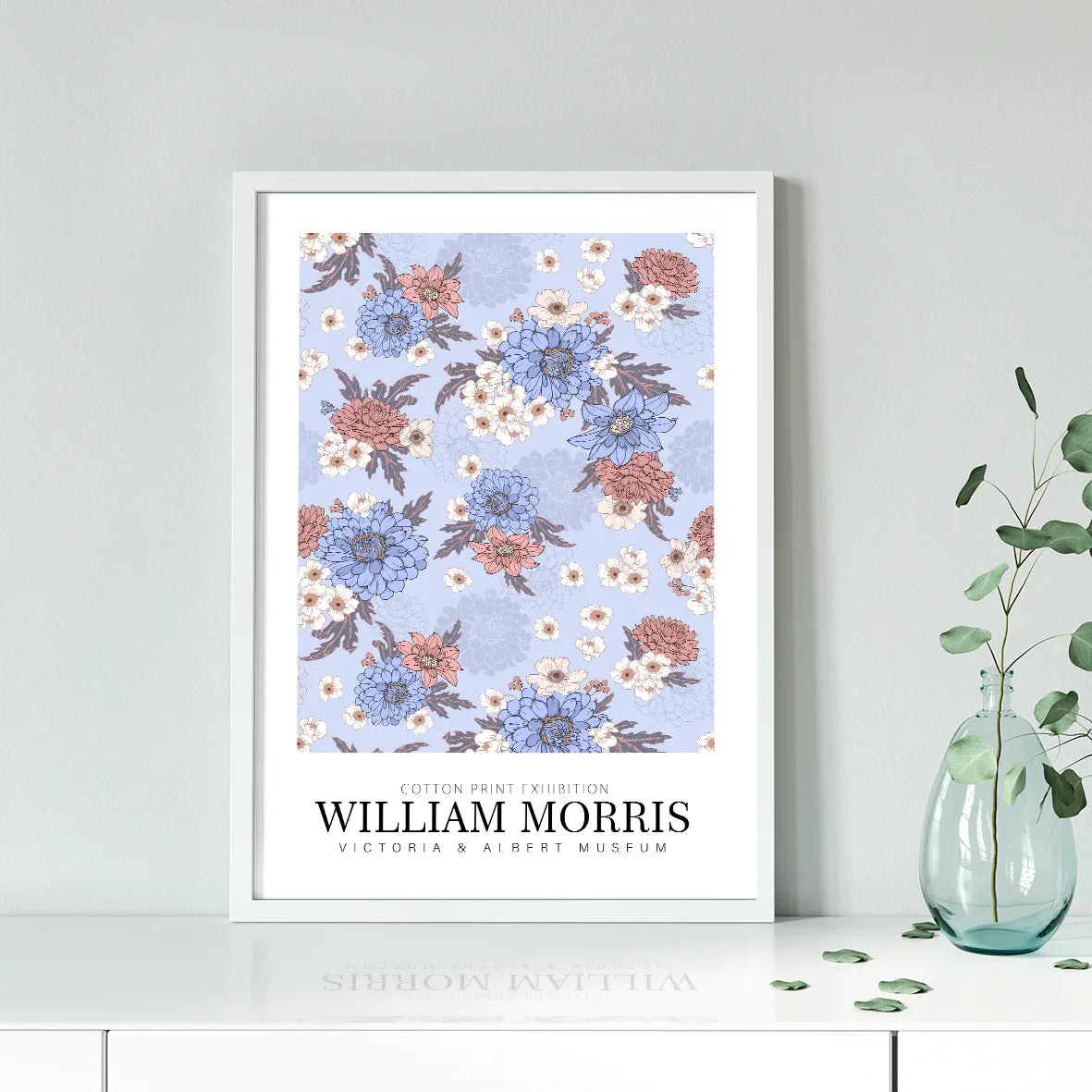 William Morris exhibition cotton print with pastel flowers on a blue background