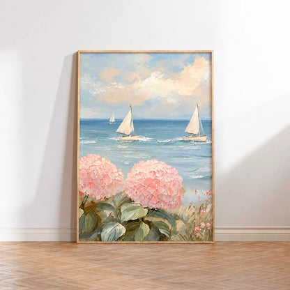 ピンクの紫陽花と青い海を進む白いヨットを描いた左側のポスターを床に置いたイメージ