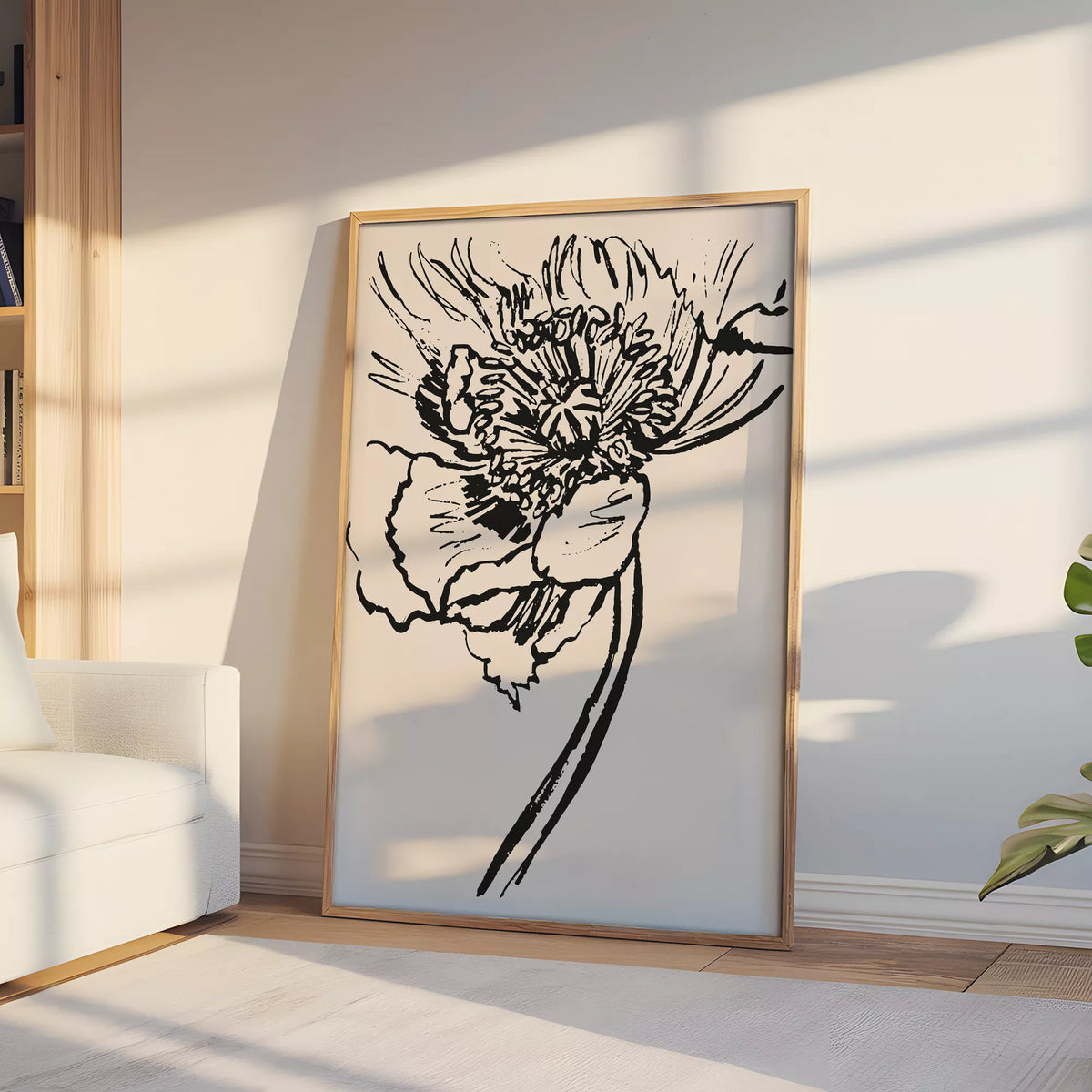 日差しが差し込む窓辺の木製の台に飾った、ベージュの大輪の花のラインアートポスター